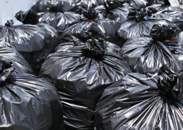 Newborn boy found inside backpack in rubbish pile