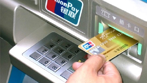 Macau ATMs need face time before payout to follow the money