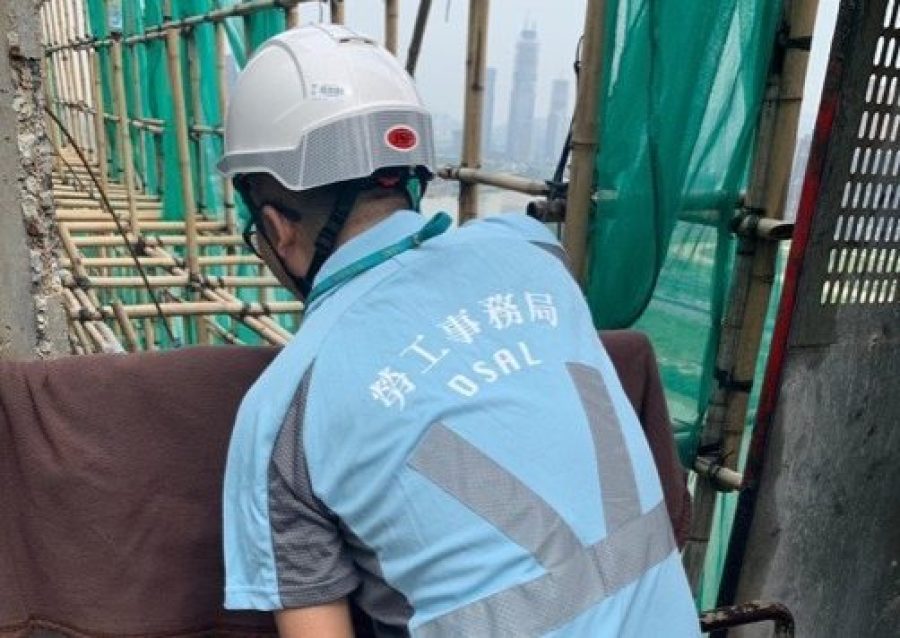 Labourers threaten to jump from building in wages protest