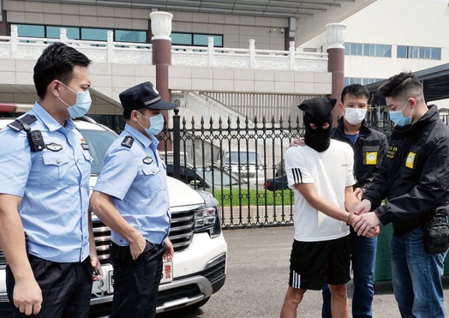 Man jailed in mainland handed to Macau for trial for 4 robberies in 1990s