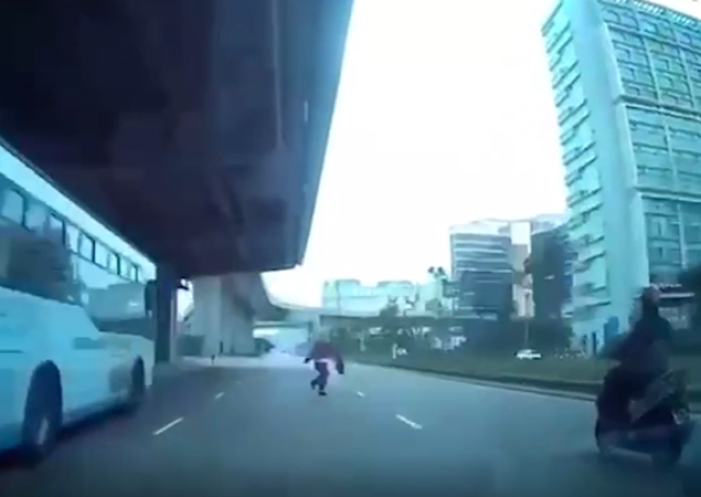 Boy runs out into road near airport, hit by scooter