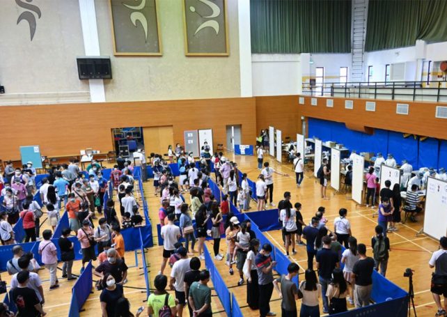 Macao residents rush to be tested at 52 stations across the city