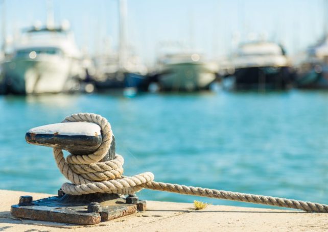 Five fishing boats sunk in mystery blaze salvaged