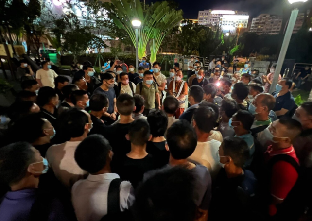 More than 200 construction workers march to Liaison Office to demand payment for quarantine fee
