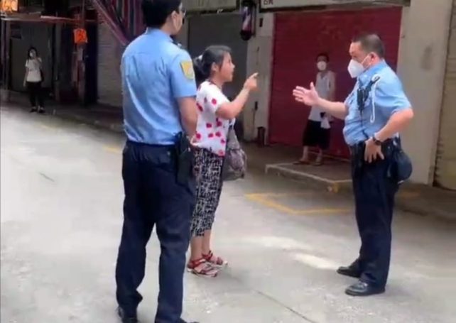 Unmasked woman demands to see Chief Executive after being stopped by police