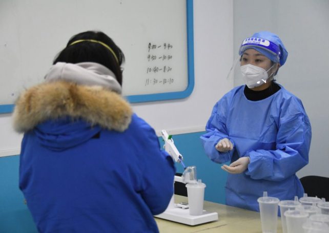 China to end quarantine and reopen borders from 8 January