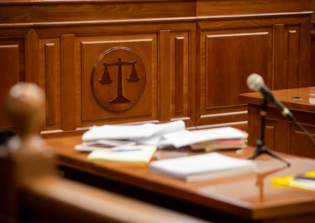 A senior public prosecutor accused of running a criminal syndicate has denied the charges